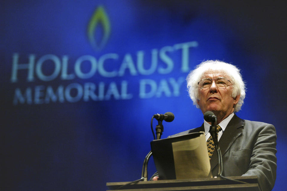 FILE - Nobel Prize-winning poet Seamus Heaney speaks during a rehearsal for the Northern Irish national Holocaust commemoration at the Waterfront Hall, Belfast, Northern Ireland, Jan. 27, 2004. Presidents have long made a point of citing a favorite writer, and for President Joe Biden that often has been Heaney, renowned for what Nobel judges in 1995 called “works of lyrical beauty and ethical depth." (AP Photo/Peter Morrison, File)