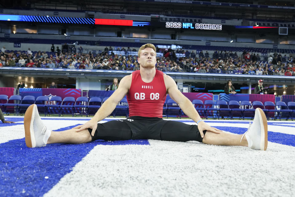 Kentucky quarterback Will Levis stretches at the NFL football scouting combine in Indianapolis, Saturday, March 4, 2023. (AP Photo/Michael Conroy)