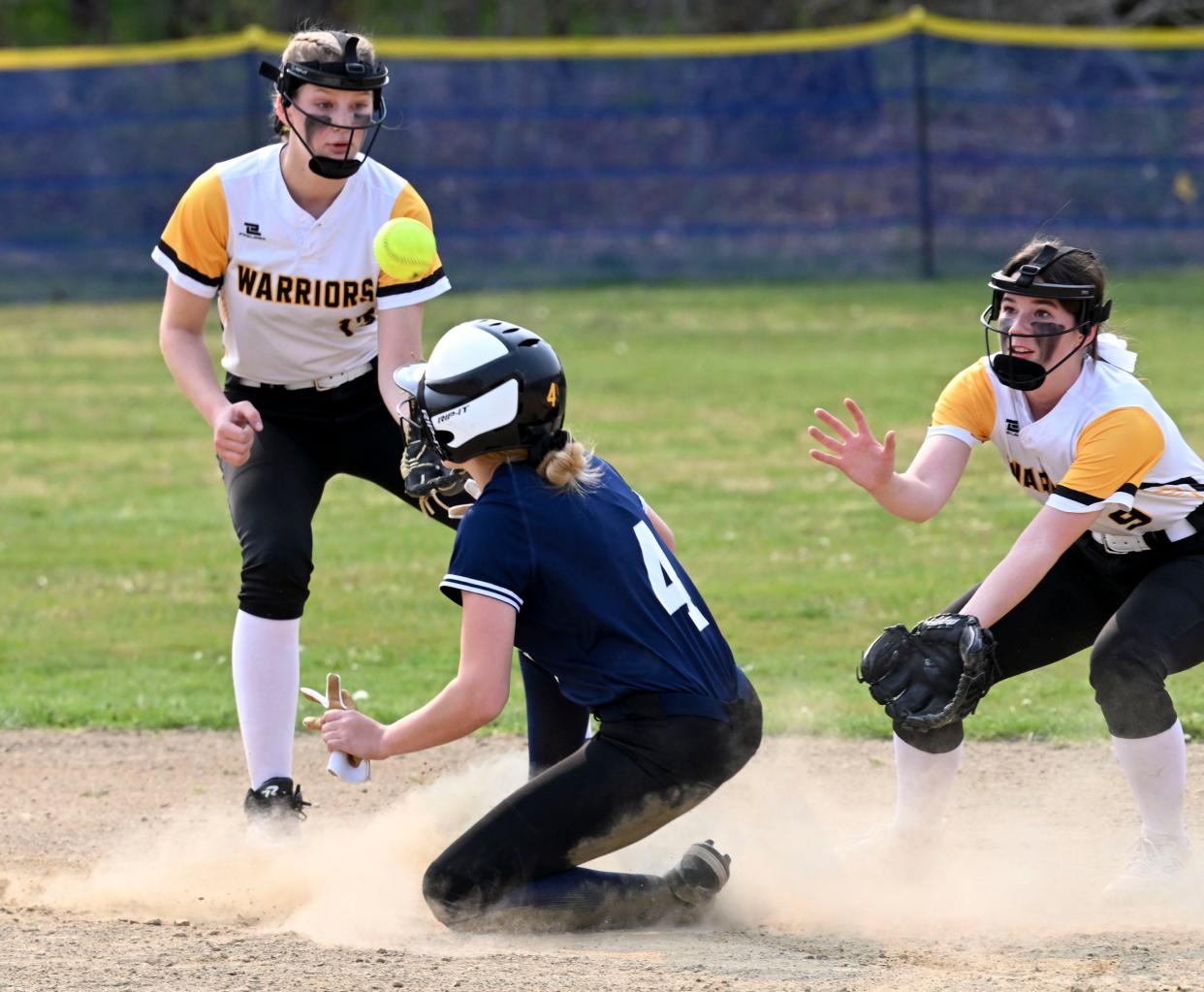 NORTH EASTHAM   5/08/23 Ryley Mayo of Sturgis arrives at second as Lili Hay (left) and Molly Farrell of Nauset watch the throw come in.
