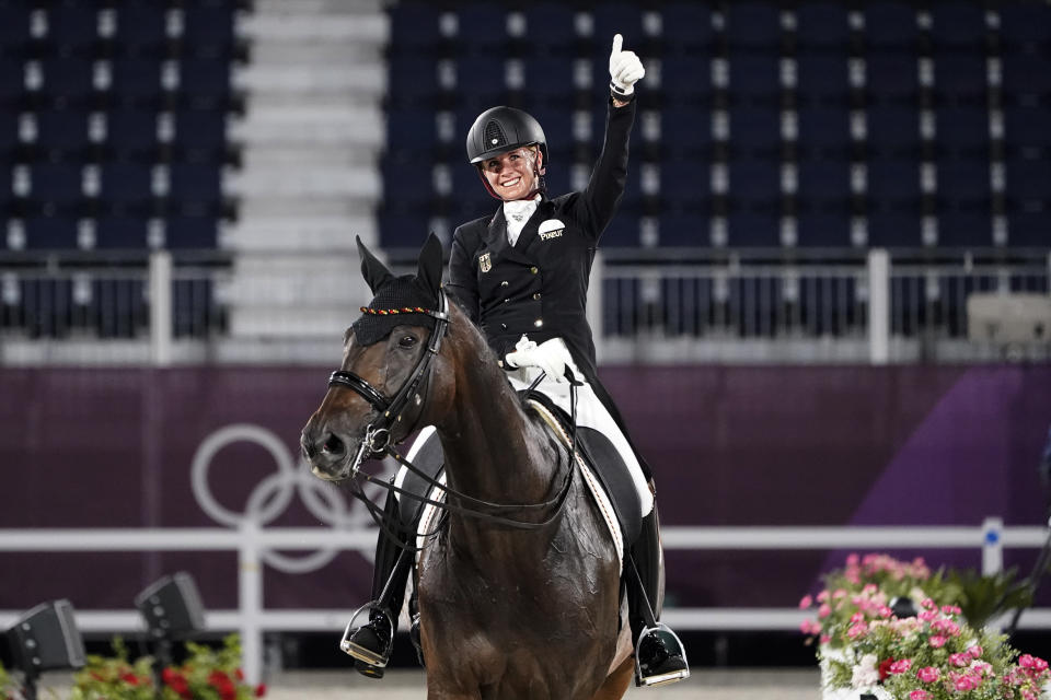 Dressage is as esoteric as sports get, but the music some riders bumped their routines Wednesday made them all the more captivating. (AP Photo/David Goldman)