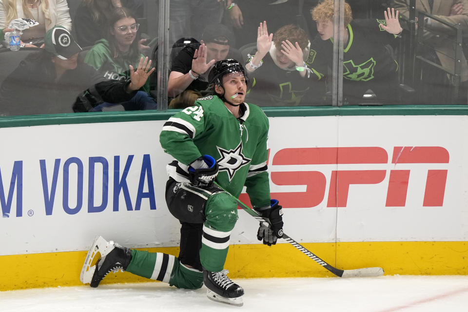 Dallas Stars center Roope Hintz kneels on the ice after being issued a penalty for embelishment in the third period in Game 2 of an NHL hockey Stanley Cup second-round playoff series against the Colorado Avalanche in Dallas, Tuesday, May 7, 2024. (AP Photo/LM Otero)