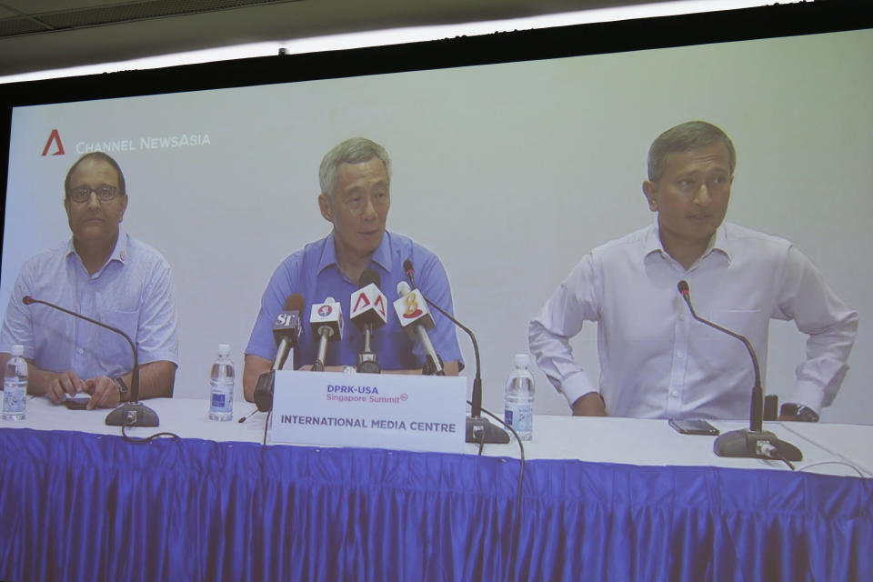 Singapore’s Prime Minister Lee Hsien Loong (centre) speaking during a press conference at the International Media Centre for the 2018 US-DPRK Summit. With him are Minister for Communications and Information S Iswaran (left) and Foreign Minister Vivian Balakrishnan. (PHOTO: Channel NewsAsia screengrab)