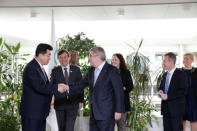 International Olympic Committee (IOC) President Thomas Bach from Germany welcomes North Korea's Olympic Committee President and Minister of Physical Culture and Sports Kim Il Guk and South Korean Sports Minister Do Jong-hwan, during a working meeting to discuss further sports cooperation between the Republic of Korea (ROK) and the Democratic People’s Republic of Korea (DPRK) as well as their bid to co-host the 2032 Summer Olympics, at the IOC Headquarters in Lausanne, Switzerland, February 15, 2019. Salvatore Di Nolfi/Pool via REUTERS