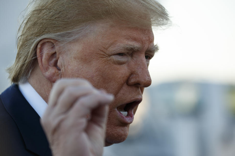 President Donald Trump talks to reporters before boarding Air Force One for a trip to Chicago to attend the International Association of Chiefs of Police Annual Conference and Exposition, Monday, Oct. 28, 2019, in Andrews Air Force Base, Md. (AP Photo/Evan Vucci)