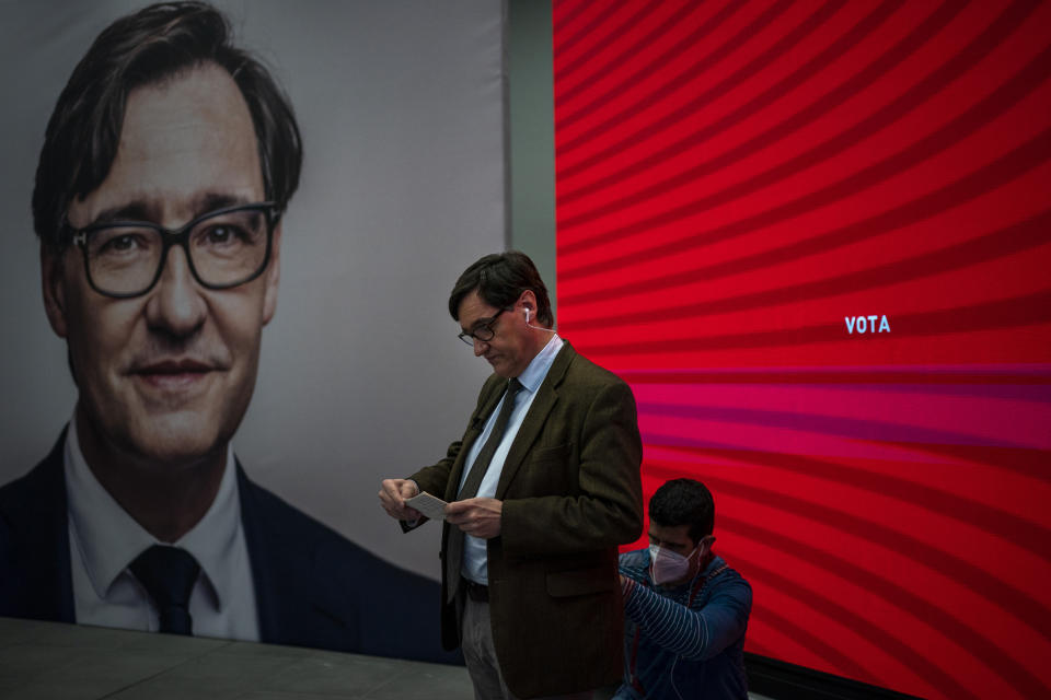 Catalan Socialist Party (PSC) candidate in the upcoming Catalan elections Salvador Illa, reads notes ahead of an interview at his party headquarter in Barcelona, Spain, Monday, Feb. 8, 2021. A former health minister of Spain hopes to become a quiet political disruptor in the country's Catalonia region when voters go to the polls next weekend. (AP Photo/Emilio Morenatti)