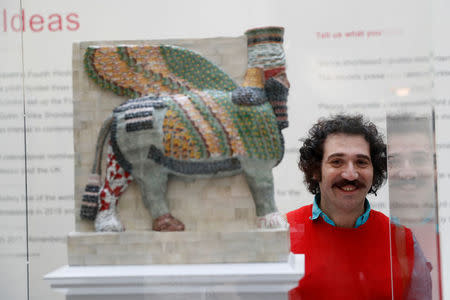 Artist Michael Rakowitz stands beside a scale model of his sculpture 'The Invisible Enemy Should Not Exist' at the National Gallery, after it won the competition to become one of the pieces to be displayed on the fourth plinth in Trafalgar Square, in central London, Britain, March 21, 2017. REUTERS/Stefan Wermuth