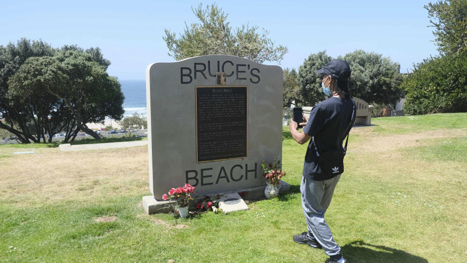 FILE - This April 8, 2021 file photo, shows a monument at Bruce's Beach in Manhattan Beach, Calif.. Los Angeles County leaders took initial steps Tuesday, April 20, 2021, toward returning prime beachfront property to descendants of a Black couple who built a resort for African Americans but were stripped of the land by local city officials a century ago. (Dean Musgrove/The Orange County Register via AP, File)