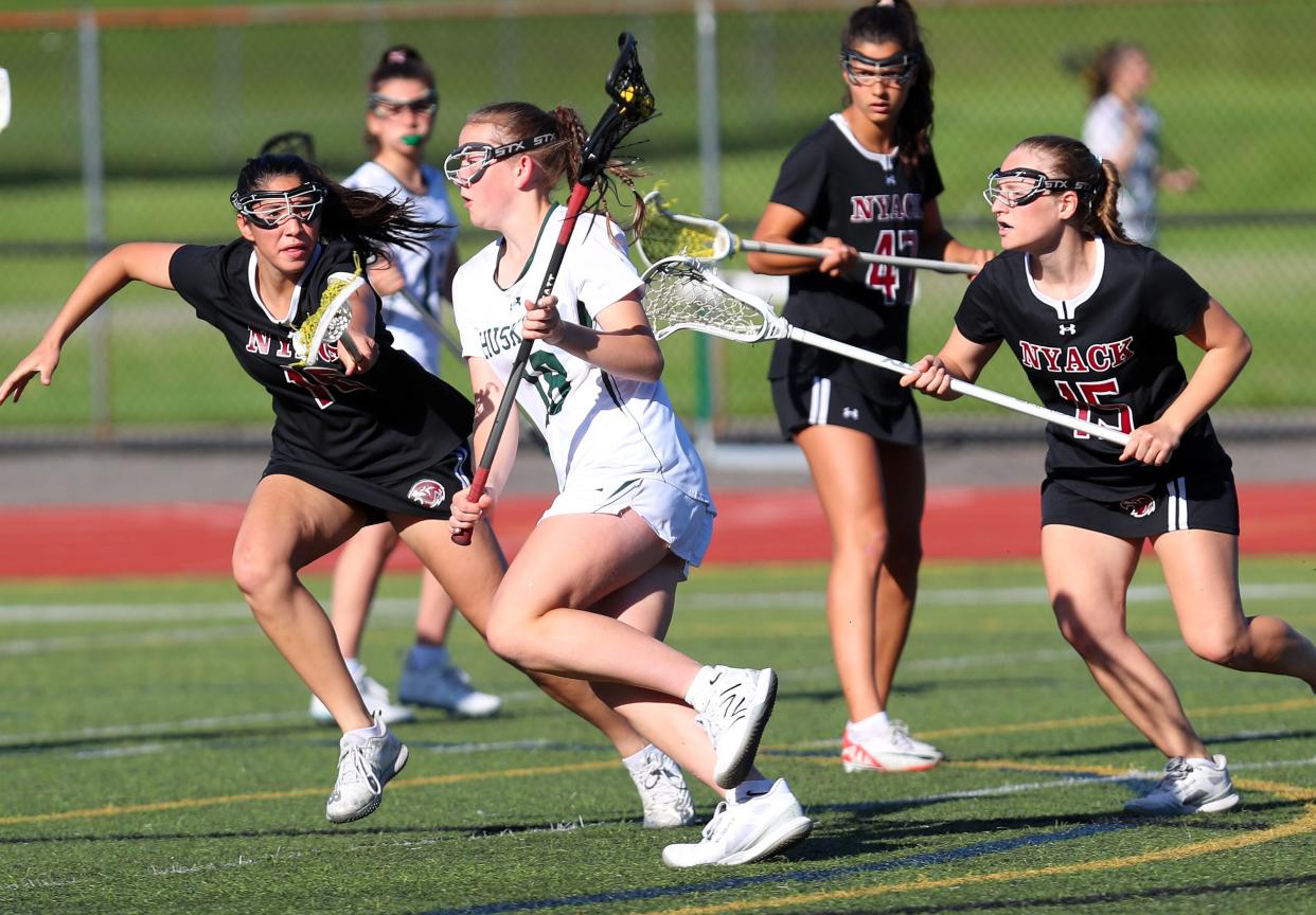 YorktownÕs Ava Ryan (18) drives to the gaol against Nyack during girls lacrosse action at Yorktown High School May 7, 2024. Nyack won the game 10-7.