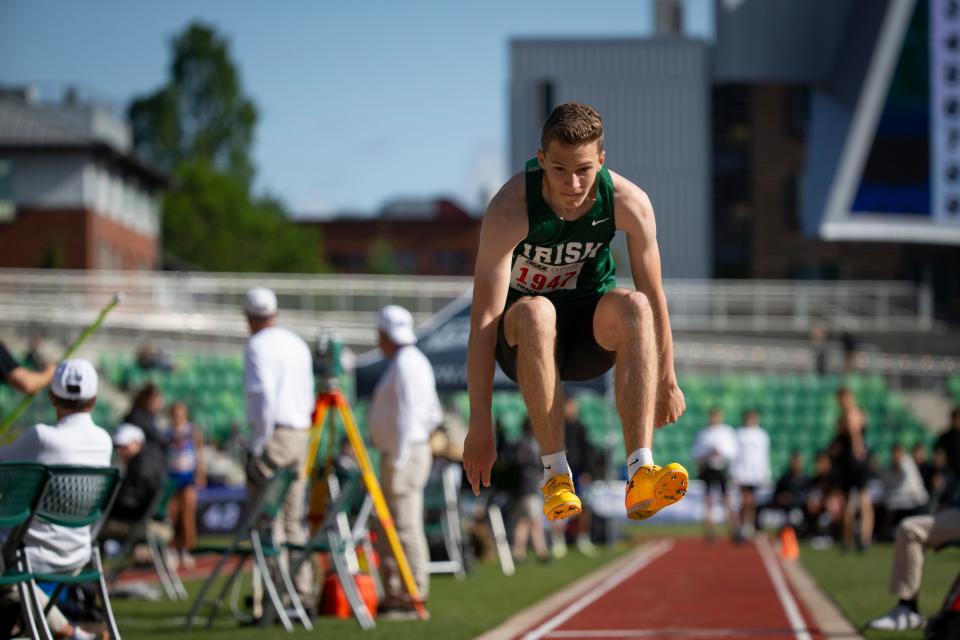 Sheldon’s Eli Forsha jumps in the 6A triple jump during day two of the OSAA State Track and Field Championships May 17 at Hayward Field in Eugene.