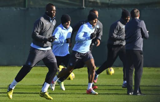 Manchester City's Mario Balotelli (L) during a team training session in Manchester, north-west England, on November 5. Roberto Mancini's side will attempt to recover from yet another European disappointment when they return to Premier League action against Tottenham Hotspur on Sunday