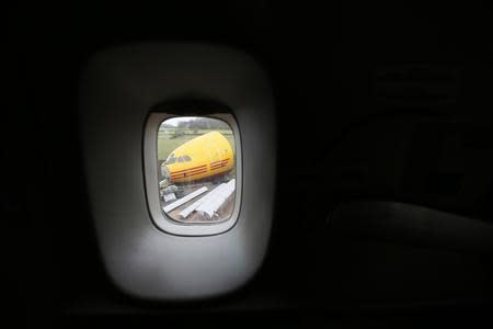 A dismantled Airbus A300 is seen through a window of a Boeing 747 in the recycling yard of Air Salvage International (ASI) in Kemble, central England November 27, 2013. REUTERS/Stefan Wermuth