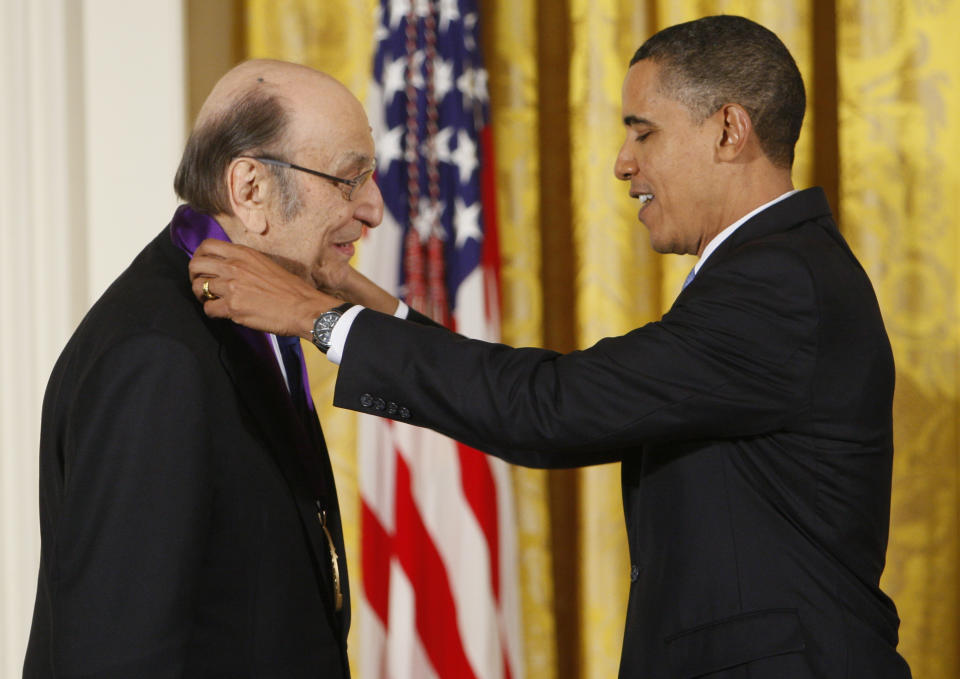 FILE - In this Thursday, Feb. 25, 2010, file photo, President Barack Obama presents a 2009 National Medal of Arts to Milton Glaser, in the East Room of the White House in Washington. Glaser, the designer who created the “I (HEART) NY” logo and the famous Bob Dylan poster with psychedelic hair, died Friday, June 26, 2020, his 91st birthday. (AP Photo/Charles Dharapak, File)