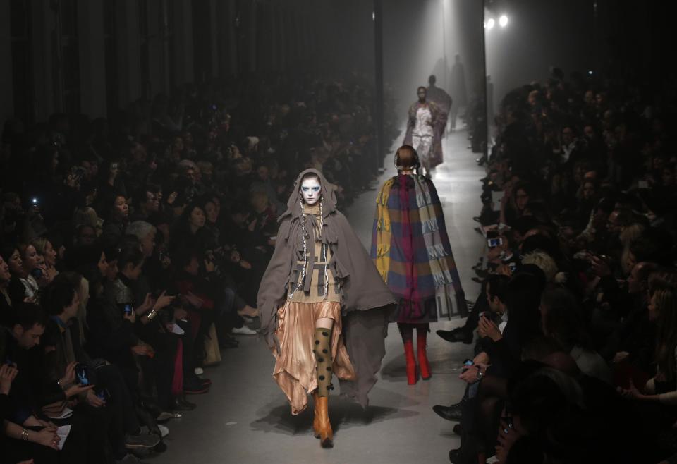 Models wear creations by designer Vivienne Westwood for her Fall/Winter 2013-2014 ready to wear collection, in Paris, Saturday, March 2, 2013. (AP Photo/Christophe Ena)