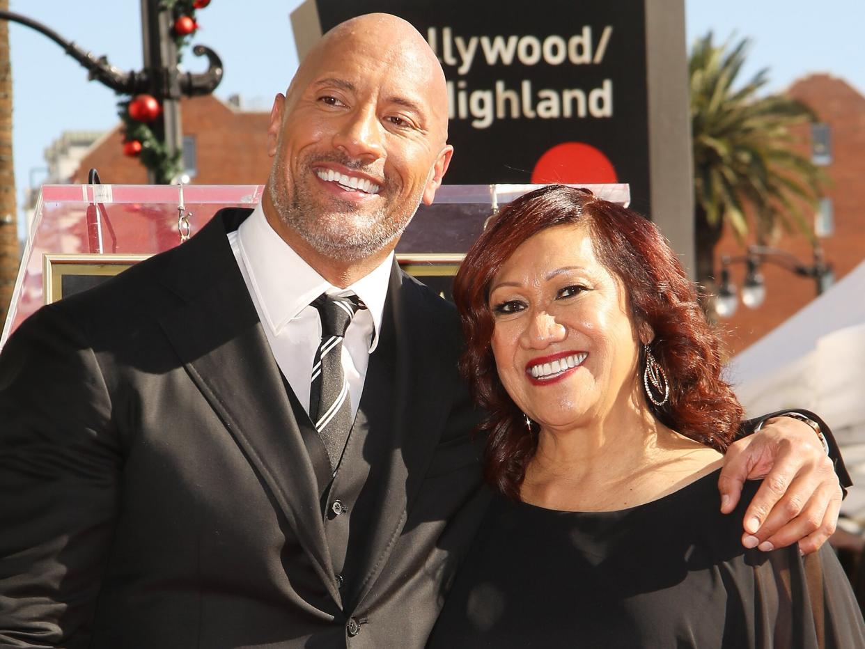 Dwayne Johnson and his mom, Ata Johnson attend the ceremony honoring Dwayne Johnson with a Star on The Hollywood Walk of Fame held on December 13, 2017 in Hollywood, California