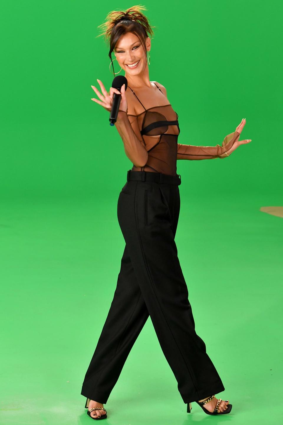 <p>Bella Hadid smiles and waves while recording a segment for the MTV Video Music Awards on Sunday. </p>