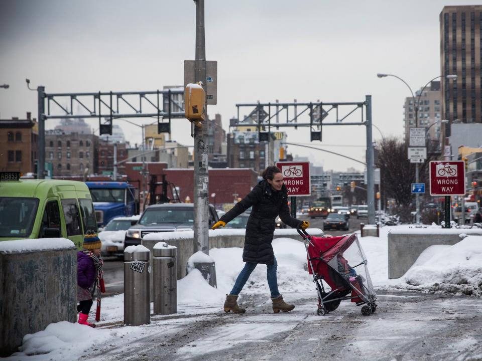 woman pushing stroller