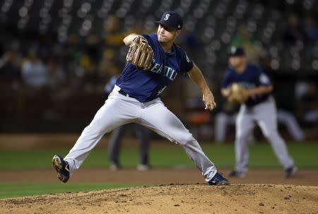 Aug 30, 2018; Oakland, CA, USA; Seattle Mariners starting pitcher Wade LeBlanc (49) delivers against the Oakland Athletics during the third inning of a Major League Baseball game at Oakland Coliseum. Mandatory Credit: D. Ross Cameron-USA TODAY Sports