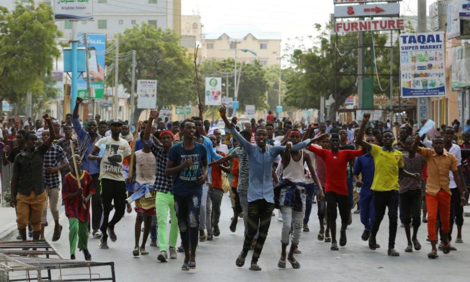 Protesters walk through Mogadishu.