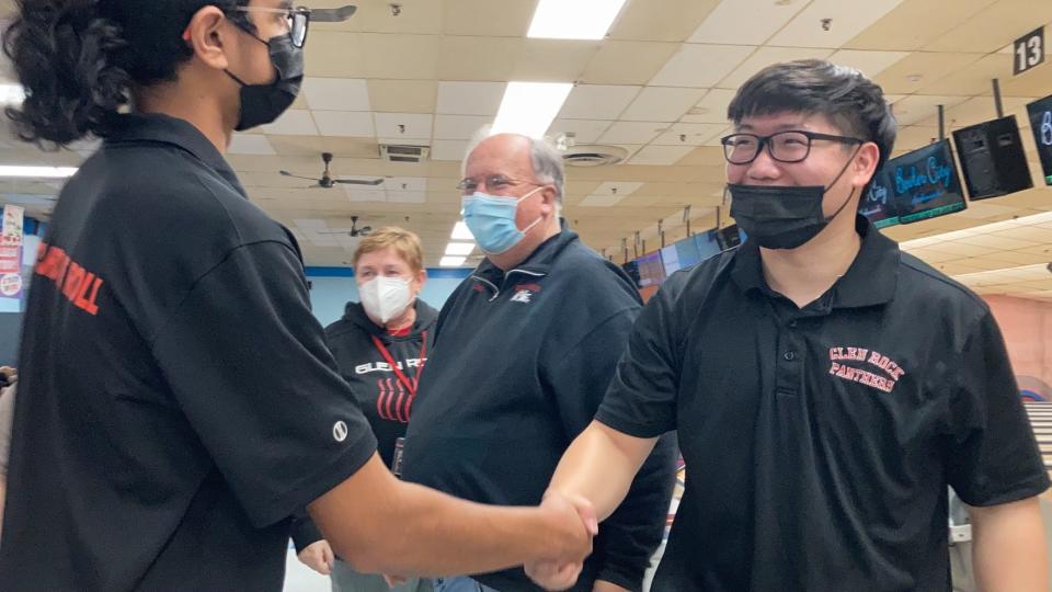 Glen Rock’s Andrew Lee (right) and Cliffside Park’s Aavinaash Rampersad shake hands after Lee won their matchup, 221-207, in the stepladder final of the Bergen County boys bowling individual tournament. From Monday, Jan. 31, 2022 at Bowler City in Hackensack.