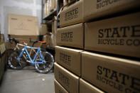 Bicycles are boxed up to be shipped at State Bicycle in Tempe