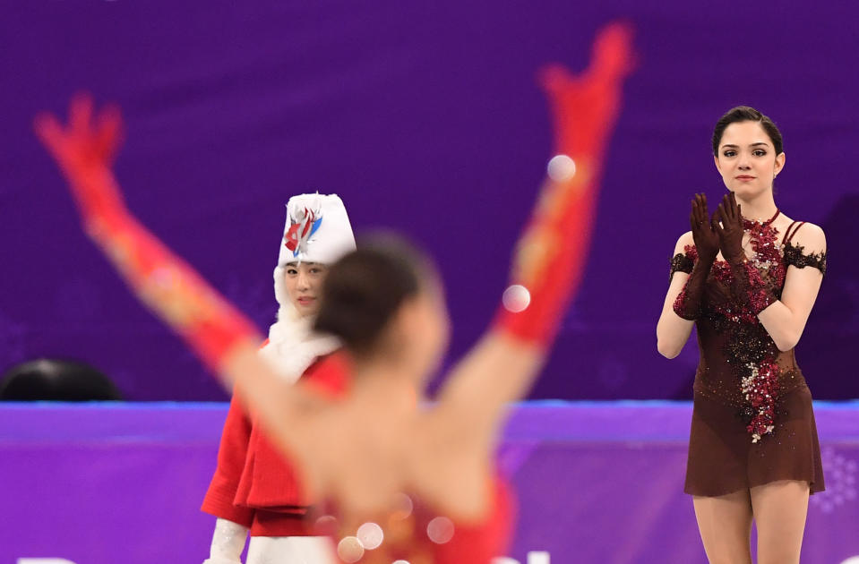 <p>Gold medallist Russia’s Alina Zagitova celebrates (L) as silver medallist Russia’s Evgenia Medvedeva claps before the venue ceremony after the women’s single skating free skating of the figure skating event during the Pyeongchang 2018 Winter Olympic Games at the Gangneung Ice Arena in Gangneung on February 23, 2018. / AFP PHOTO / Roberto SCHMIDT </p>