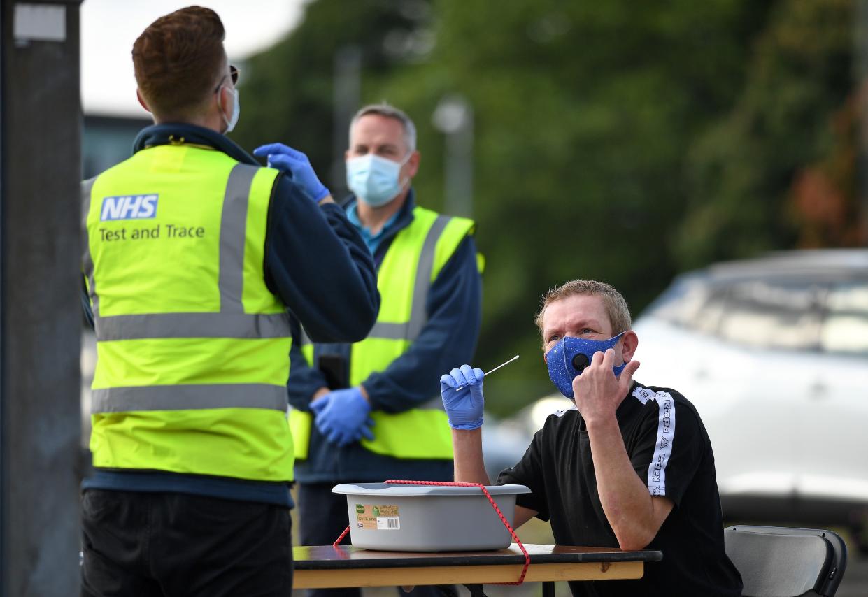 A man completes a self-administered Covid-19 test at a walk-in testing centre in Bolton last week (Oli Scarff/AFP via Getty Images)