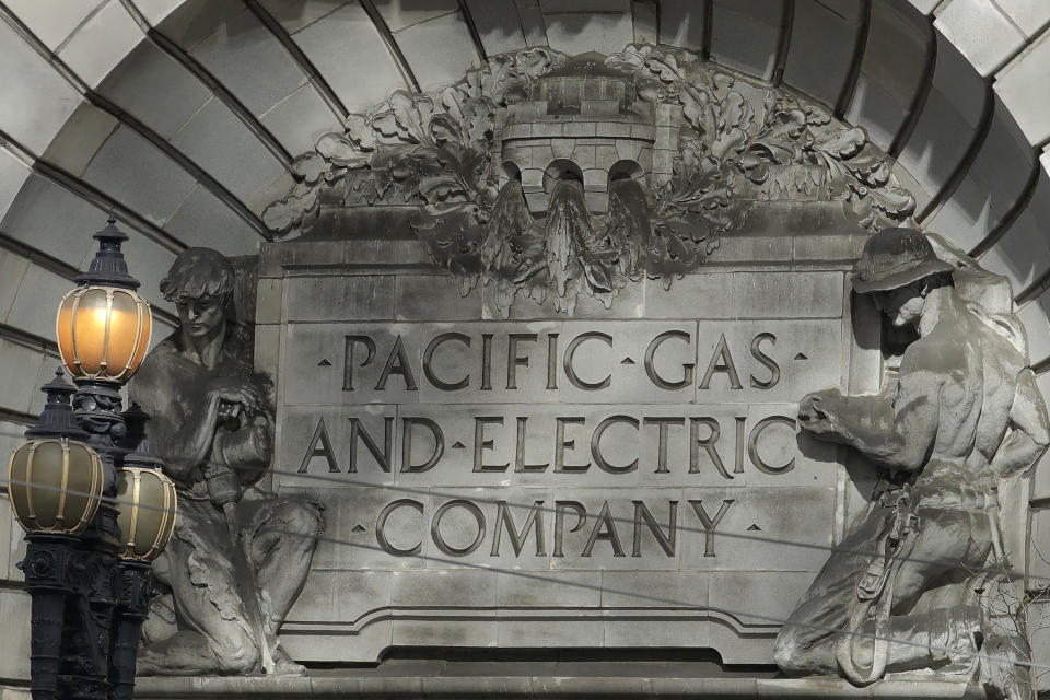 FILE - In this Oct. 10, 2019, file photo, a Pacific Gas & Electric sign is shown outside of a PG&E building in San Francisco. Pacific Gas & Electric says its plan for getting out of bankruptcy has won overwhelming support from the victims of deadly Northern California wildfires ignited by the utility's fraying electrical grid. The victims backed PG&E's blueprint despite concerns that they will be shortchanged by a $13.5 billion fund that's supposed to cover their losses. The preliminary results of a vote announced Monday, May 18, 2020, keep PG&E on track for meeting a June 30 deadline to get out of bankruptcy so it can qualify for coverage from a California wildfire insurance fund that was created to help protect the utility from getting into financial trouble again. (AP Photo/Jeff Chiu, File)