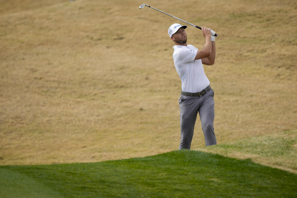 Sam Burns watches his second shot on the second hole of the Pete Dye Stadium Course during the final round of the American Express golf tournament, Sunday, Jan. 21, 2024, in La Quinta, Calif. (AP Photo/Ryan Sun)