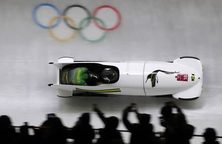 Bobsleigh - Pyeongchang 2018 Winter Olympics - Women's Competition - Olympic Sliding Centre - Pyeongchang, South Korea - February 20, 2018 - Jazmine Fenlator-Victorian and Carrie Russell of Jamaica in action. REUTERS/Arnd Wiegmann