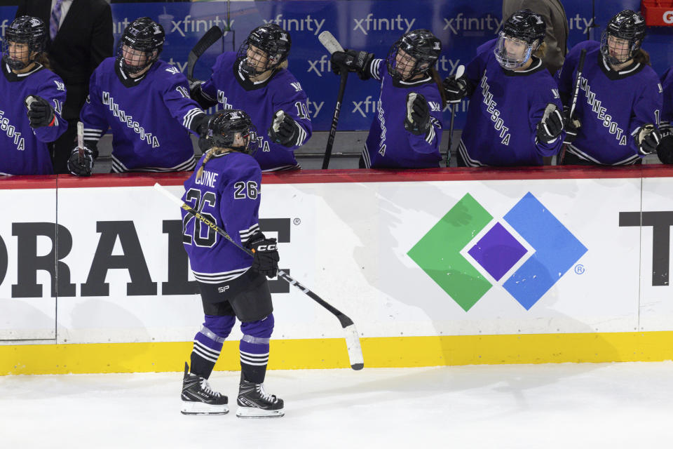 Minnesota forward Kendall Coyne (26) is congratulated after scoring a goal against Toronto during the third period of a PWHL hockey game Wednesday, Jan. 10, 2024, in St. Paul, Minn. (AP Photo/Bailey Hillesheim)