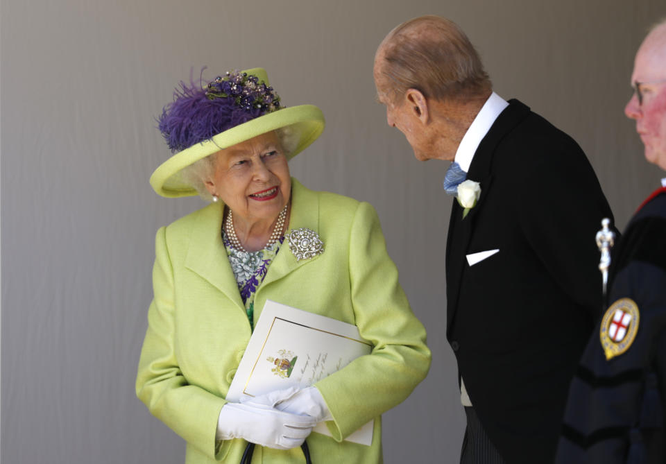 WINDSOR, UNITED KINGDOM - MAY 19:  Queen Elizabeth II talks with Prince Philip, Duke of Edinburgh after the wedding of Prince Harry and Meghan Markle at St George's Chapel at Windsor Castle on May 19, 2018 in Windsor, England. (Photo by Alastair Grant - WPA Pool/Getty Images)