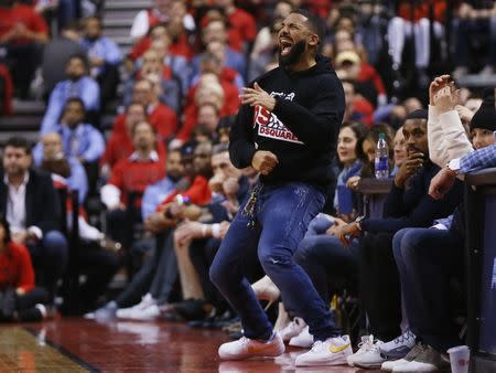 May 21, 2019; Toronto, Ontario, CAN; Recording artist Drake reacts from the sideline after a play by the Toronto Raptors against the Milwaukee Bucks during game four of the Eastern conference finals of the 2019 NBA Playoffs at Scotiabank Arena. Toronto defeated Milwaukee. Mandatory Credit: John E. Sokolowski-USA TODAY Sports