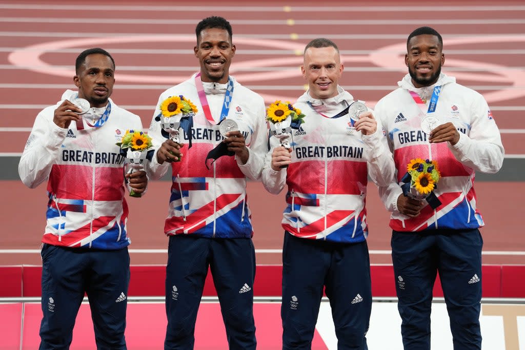 Ujah, left, with team-mates Zharnel Hughes, Richard Kilty and Nethaneel Mitchell-Blake on the podium in Tokyo (Martin Rickett/PA) (PA Wire)