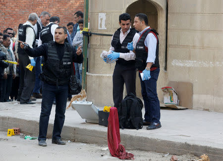 Police inspect the site of an attack on a church in the Helwan district south of Cairo, Egypt December 29, 2017. REUTERS/Amr Abdallah Dalsh