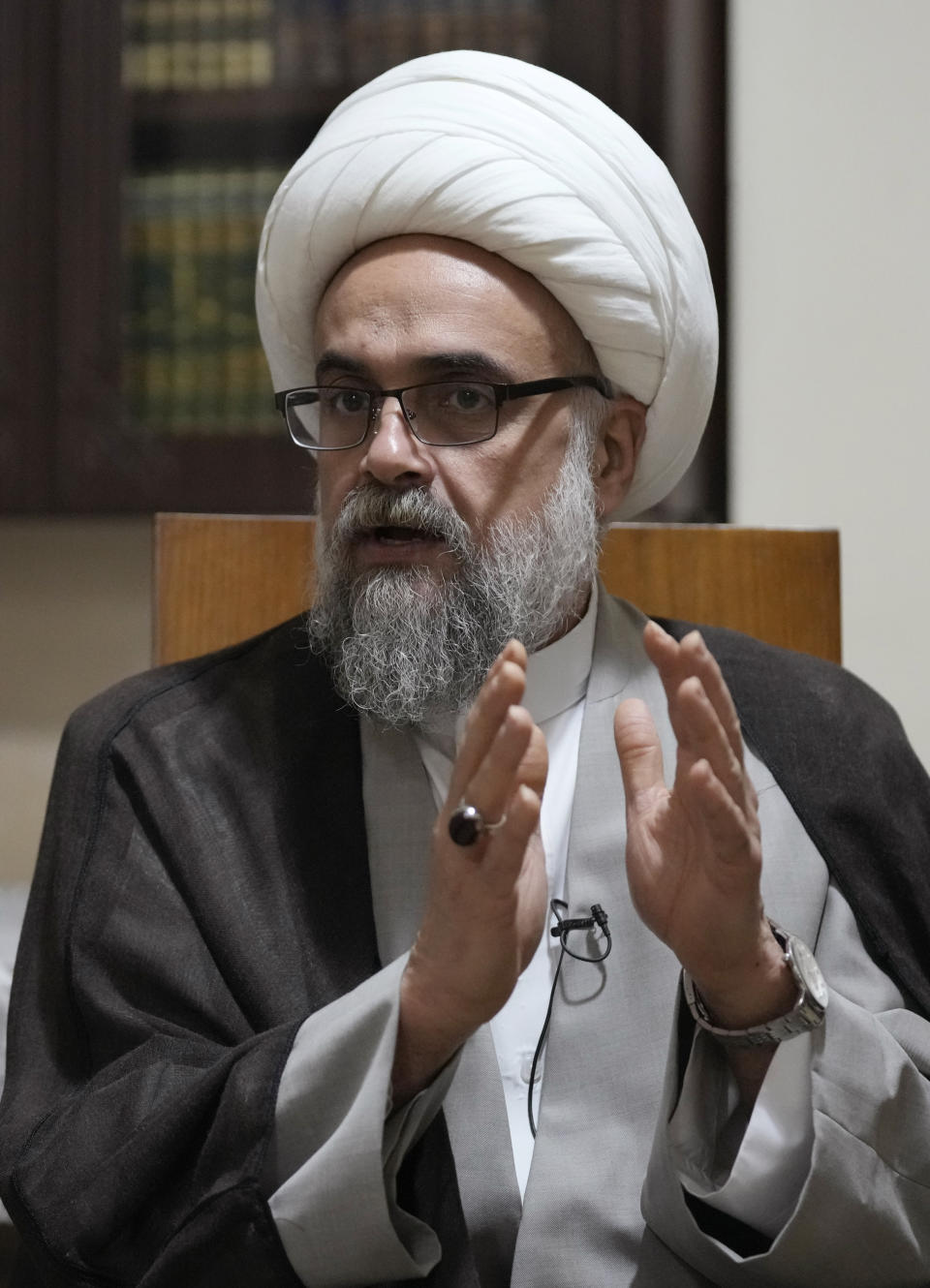 Shiite cleric Yasser Auda gestures as he speaks during an interview with The Associated Press at his house in the southern suburb of Beirut, Lebanon, Friday, Aug. 18, 2023. Auda, who has angered politicians and religious leaders in Lebanon and Iraq by his harsh criticism says groups including Lebanon's Hezbollah are trying to silence voices of dissent within the sect including his days after he almost stripped of his religous status. (AP Photo/Hussein Malla)