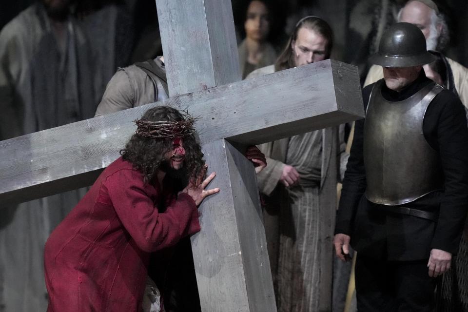 Rochus Rueckel as Jesus peforms with cast members during the rehearsal of the 42nd Passion Play in Oberammergau, Germany, Wednesday, May 4, 2022. After a two-year delay due to the coronavirus, Germany's famous Oberammergau Passion Play is opening soon. The play dates back to 1634, when Catholic residents of a small Bavarian village vowed to perform a play of the last days of Jesus Christ every 10 years, if only God would spare them of any further Black Death victims. The town did suffer some COVID-19 deaths, but the show goes on. Almost half of the village's residents— more than 1,800 people including 400 children — will participate. (AP Photo/Matthias Schrader)