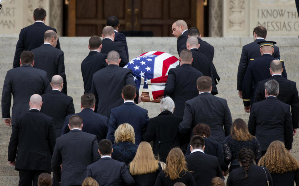 Flag-draped casket