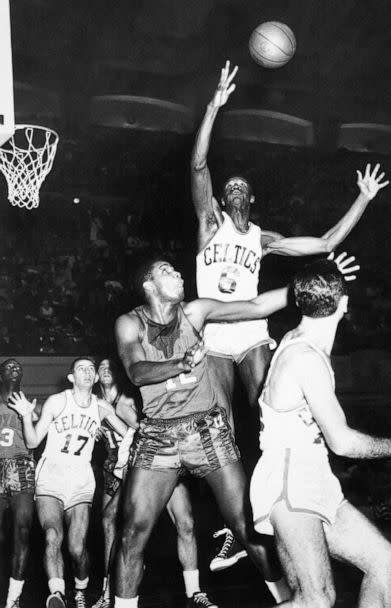 PHOTO: In this Dec. 27, 1956, file photo, Boston Celtics' Bill Russell (6) reaches for a rebound in an NBA basketball game against the Rochester Royals in Philadelphia. (Sam Myers/AP, FILE)