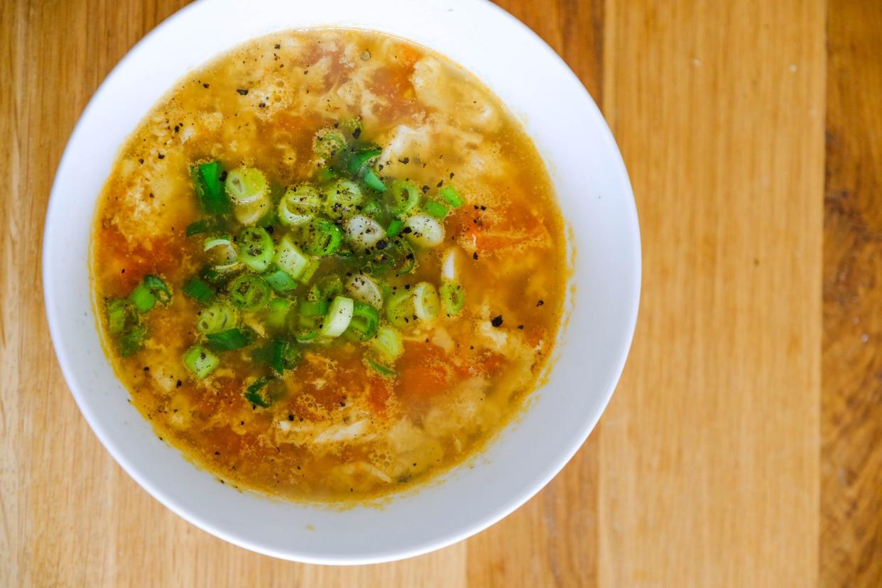 Close up of a bowl of homemade tomato egg drop soup