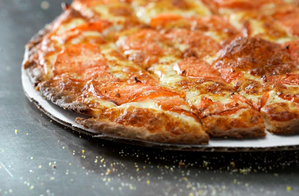 Family-owned Terita's Pizza has been serving "Columbus-stye" pizza since 1959, featuring edge-to-edge toppings and a thin crust cut into squares.