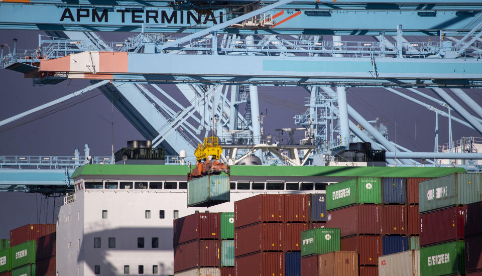 Los Angeles CA - October 13 Thousands of containers  are unloaded from a ship at the Ports of Los Angeles and Long Beach, while dozens of large container ships wait to be unloaded offshore Wednesday, Oct. 13, 2021. President Biden is set to announce Wednesday that the Port of Los Angeles would operate around the clock to alleviate a logistical bottleneck that has left dozens of container ships idling off the California coast and Americans waiting longer to get products manufactured overseas. The agreement to have longshoremen unloading cargo through the night is intended to speed the flow of toys, electronics and other gifts to American doorsteps during the holiday season.
(Allen J. Schaben / Los Angeles Times via Getty Images)