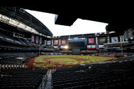 The Houston Astros and the Arizona Diamondbacks compete during the fourth inning of a baseball game Wednesday, Aug. 5, 2020, in Phoenix. (AP Photo/Matt York)