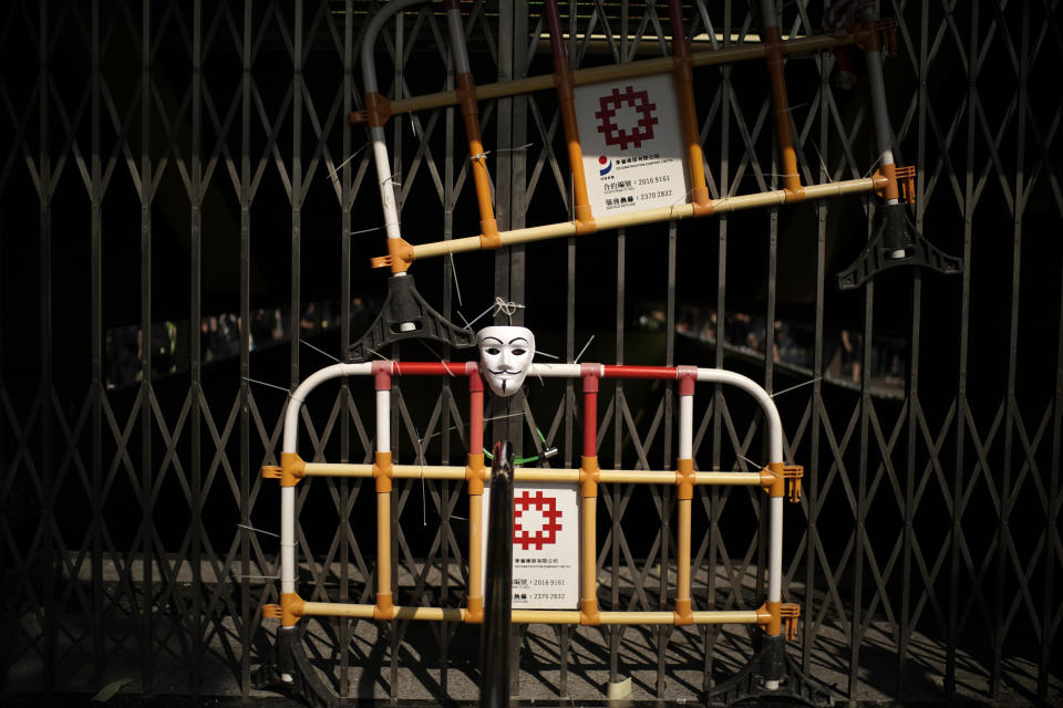 A mask hangs at the entrance of a closed public transport station in Hong Kong, Oct. 1, 2019. (Photo: Felipe Dana/AP)