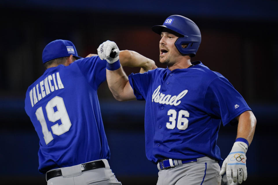 Israel's Ryan Lavarnway, right, celebrate with Danny Valencia after hitting a home run in the ninth inning a baseball game against South Korea at the 2020 Summer Olympics, Thursday, July 29, 2021, in Yokohama, Japan. (AP Photo/Sue Ogrocki)