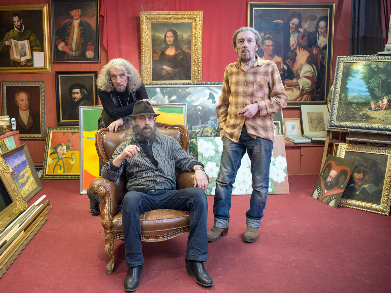 The three brothers (L-R) Eugen, Michael and Semjon Posin who are making a fortune copying great paintings pose in their Berlin art salon: Alamy