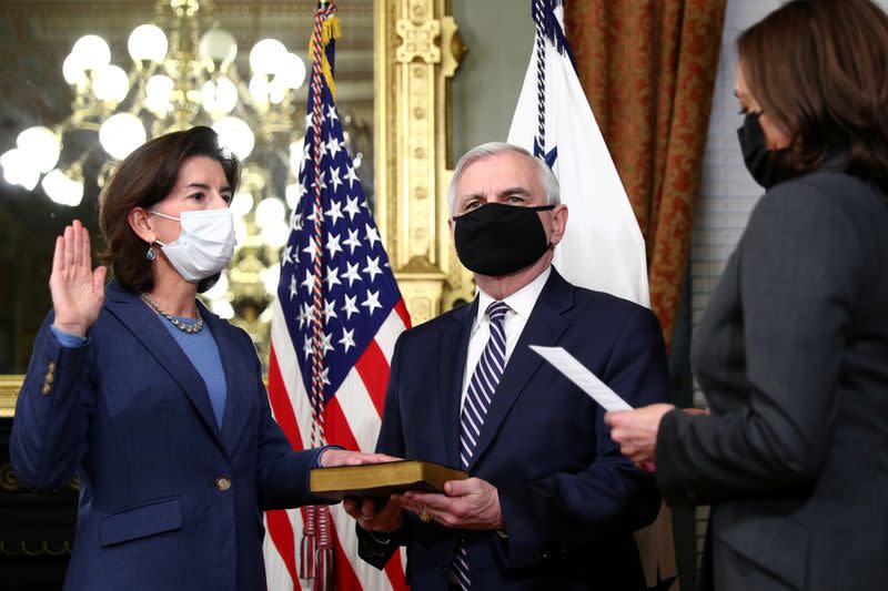 FILE PHOTO: Vice President Harris holds a ceremonial swearing-in for Secretary of Commerce Gina Raimondo at the White House in Washington