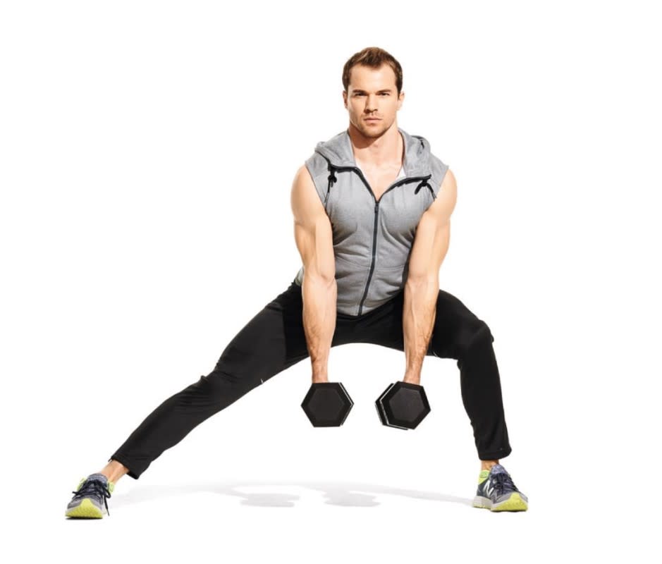 <p>Stand with feet shoulder-width apart, holding a dumbbell in each hand, palms facing one another, to start. Step laterally to one side, bending this knee to come into a lunge as you lower the dumbbells toward the ground. Drive through your foot to return to the starting position. That's 1 rep. Repeat, then switch sides. </p>