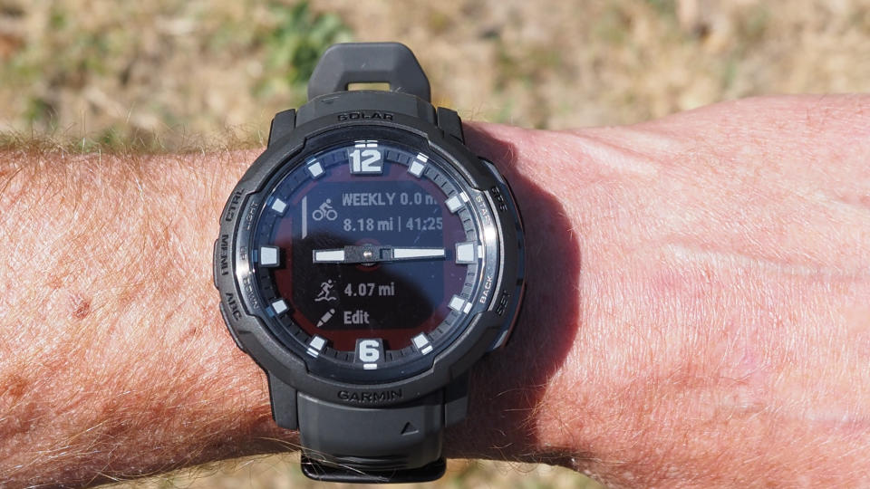 Garmin Instinct Crossover watch worn on a wrist