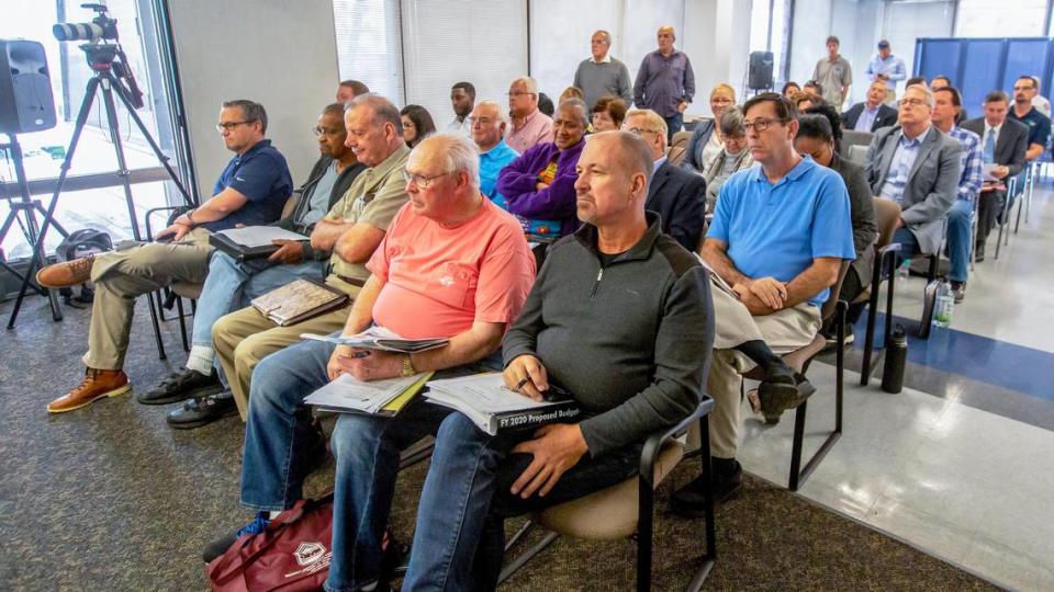 Citizens watch on during a city commission mayor meeting about all the sewage breaks in Fort Lauderdale, Florida, at City Hall on Tuesday, January 7, 2020.