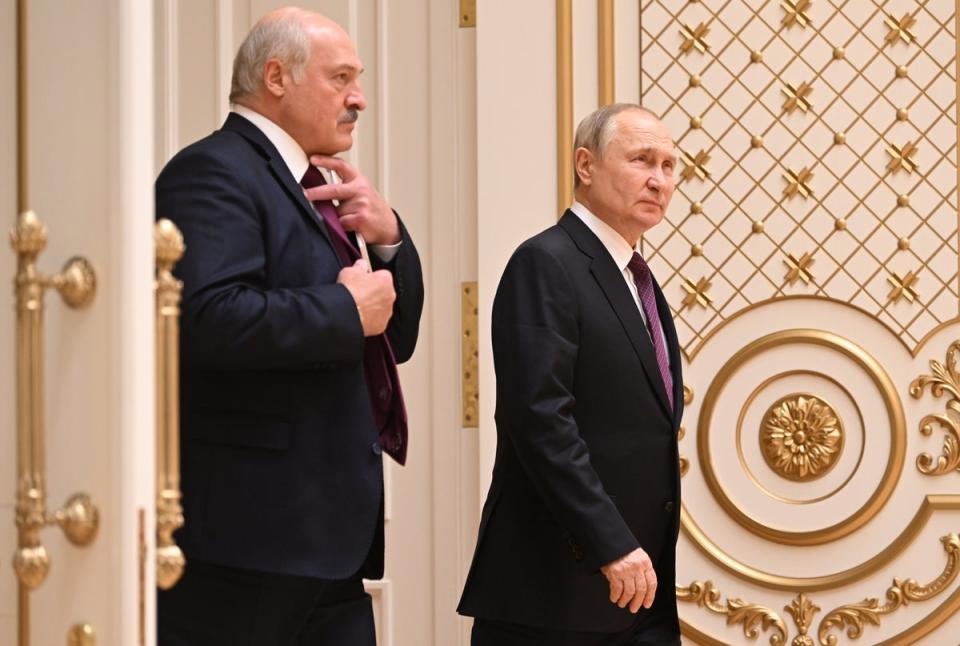 Mr Lukashenko and Mr Putin after talks at the Palace of Independence (EPA)